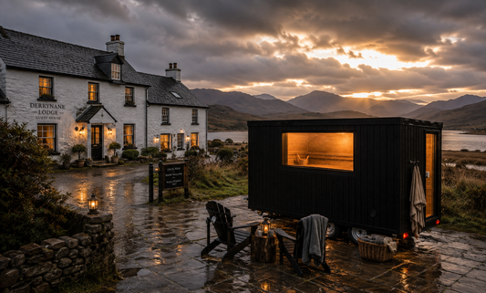 Mobile sauna unit in a dramatic Irish landscape at dusk, ideal for hotel, resort and glamping wellness experiences