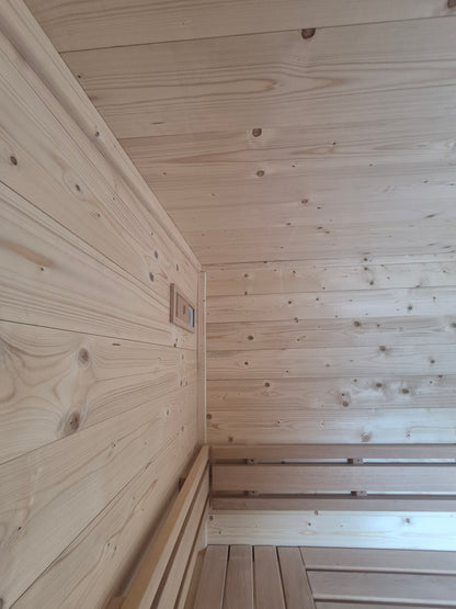 Nordic Spruce wall and ceiling cladding with timber seating inside the Atlantic mobile sauna